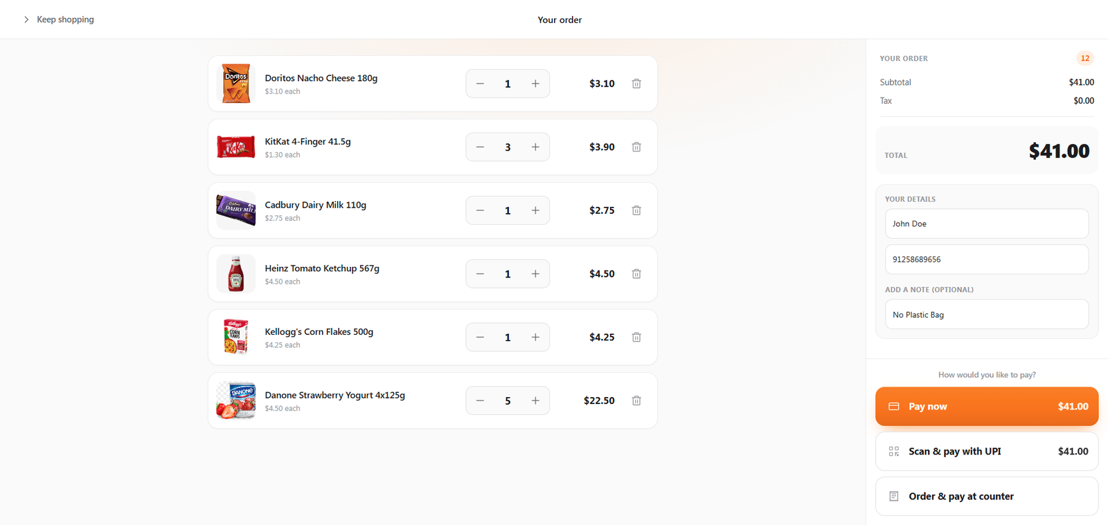 The kiosk basket screen listing two items with quantity steppers, an optional note field, the order total, and Pay now and Order and pay at counter buttons